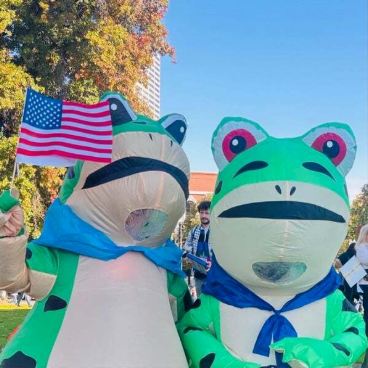 Two inflatable frogs from the No Kings protest in Portland, Oregon